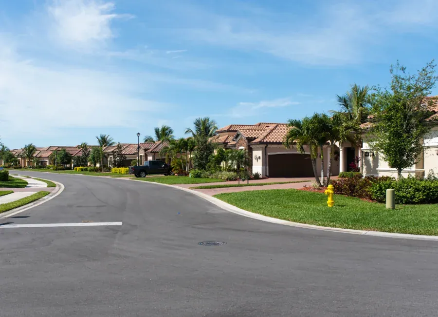 Two-story home exterior repainted in a fresh coastal palette